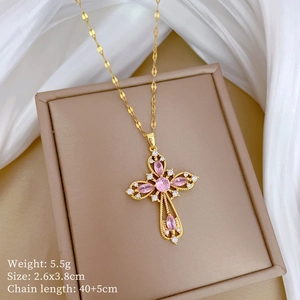 Detailed view of gold cross pendant with pink stones and necklace dimensions info