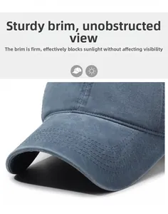 Detailed close-up of dark blue washed cotton twill baseball cap brim with sturdy stitching