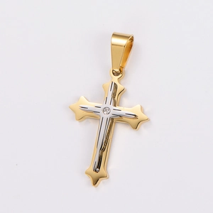 Detail of a two-tone gold and silver cross pendant with a sparkling zircon stone inlay