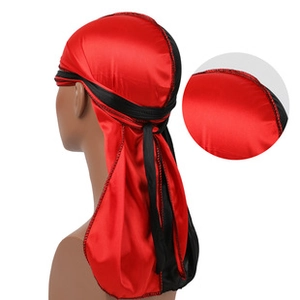 Detail of red and black satin durag showing stitching quality and silk texture