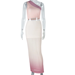 Detail of pink one-shoulder top and white gradient tulle maxi skirt two-piece set