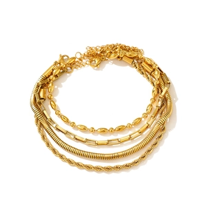 Four-piece gold layering chain bracelet set featuring snake and rope link designs
