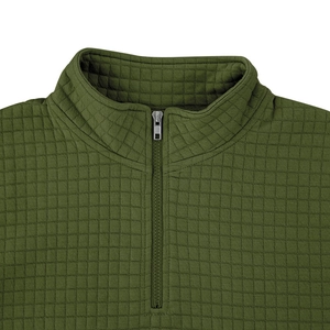 Detail of army green quilted pullover showing the stand collar and quarter zip fastener