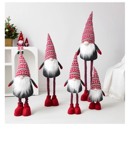 Various sizes of telescopic Christmas gnomes with knitted hats in a home interior setting