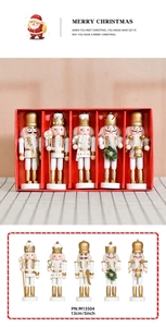 Close-up of 13cm white and gold wooden nutcracker set with detailed holiday craftsmanship