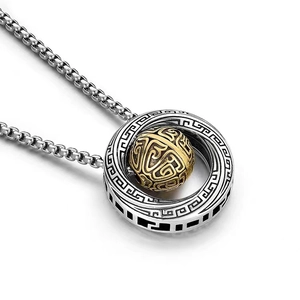 Detailed close-up of Mobius ring necklace with engraved silver band and golden rotating bead