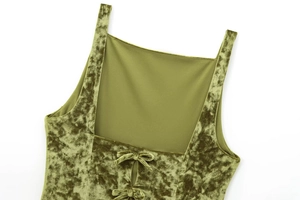 Detailed view of the olive green velvet top featuring a delicate back tie-up bow detail