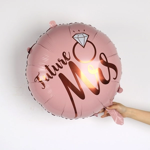 Detailed view of rose gold Future Mrs foil balloon with diamond ring graphic for weddings