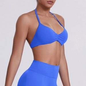 Detail view of electric blue seamless high-stretch halter sports bra with ruched front detail