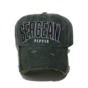 Close-up of distressed cotton baseball cap with Sergeant Pepper 3D embroidery detail