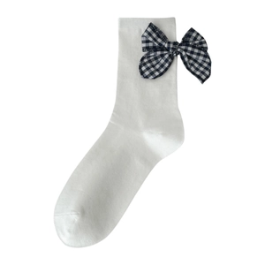 White cotton mid-calf socks with blue and white plaid bow decoration on clean white background