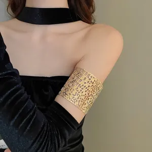 Elegant wide hollow woven gold upper arm cuff bracelet featuring geometric mesh pattern