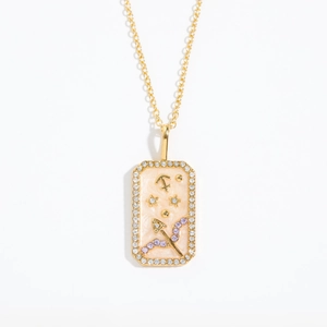 Detail view of Sagittarius zodiac necklace with pink enamel and 18K gold plating