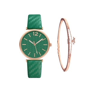 Detail of green leaf texture dial watch with rose gold star charm bracelet set