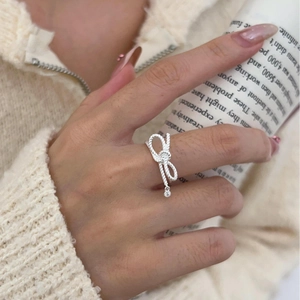 925 sterling silver bow ring with twisted rope texture and hanging zircon stone detail