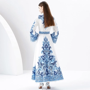 Elegant floral maxi dress with blue porcelain patterns and flared long sleeves in white