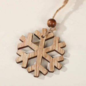 Detail of wooden snowflake ornament featuring natural wood grain and rustic jute rope