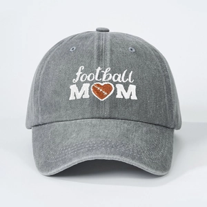 Close-up of white Football Mom embroidery and heart-shaped football on washed gray cap