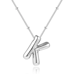 Detail of silver puffy bubble letter K pendant on a delicate bead chain necklace