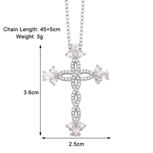 Detailed view of silver cross pendant with sparkling cubic zirconia stones and sizing specs