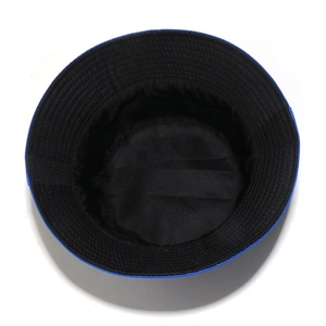 Detail view of Dominican flag sun hat featuring blue fabric with reinforced brim stitching