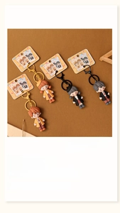 Detailed view of four cute 3D cartoon couple figurines on stylish keychains