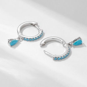 Detailed view of S925 sterling silver hoop earrings with turquoise teardrop charms