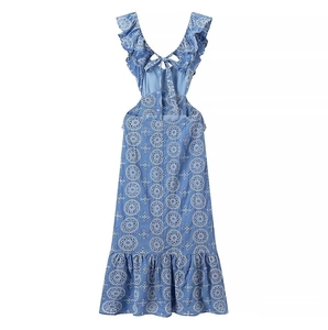 Detail of blue midi dress showing white floral embroidery and eyelet cutwork texture