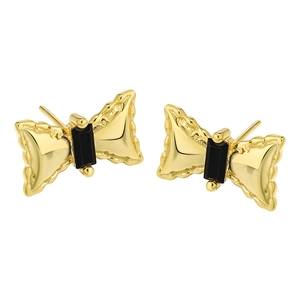 Elegant gold bow earrings with black rectangular gemstone in minimalist style