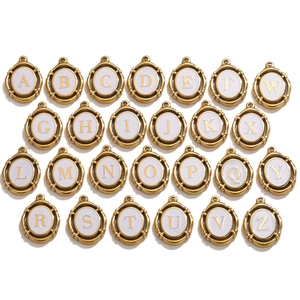 Set of 26 gold oval alphabet charms A-Z with white enamel base for DIY jewelry making