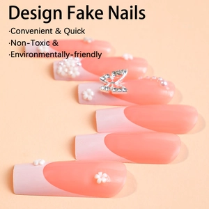 French tip press-on nails with 3D white flower and rhinestone butterfly charms