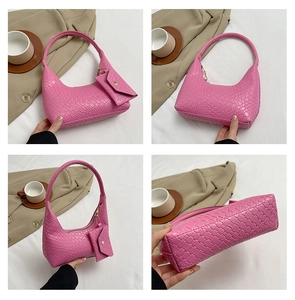 Detailed views of a pink woven texture shoulder bag with coin purse and gold zipper details