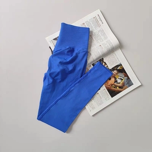 Close-up of electric blue high-waisted ribbed yoga pants with tummy control waist