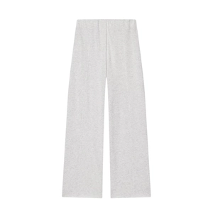 Flat lay of gray wide-leg knitted trousers on white background with smooth cotton texture
