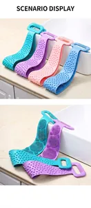 Silicone back scrubber with double-sided design showing soft bristles and massage bumps