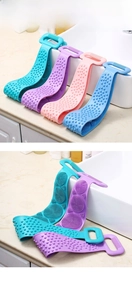 Silicone back scrubber with double-sided design showing soft bristles and massage bumps