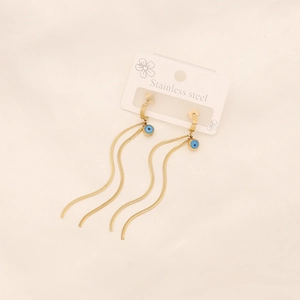 Golden stainless steel tassel earrings with evil eye charms on a flower pattern card