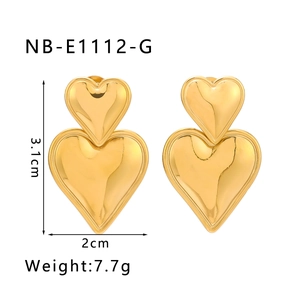 Detailed view of gold plated stainless steel heart earrings with 3.1cm size and weight specs