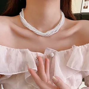 Elegant bohemian layered pearl necklace with multiple strands in a vintage french style
