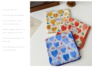Close-up of floral cotton scarves with heart patterns and elegant lace trim detail