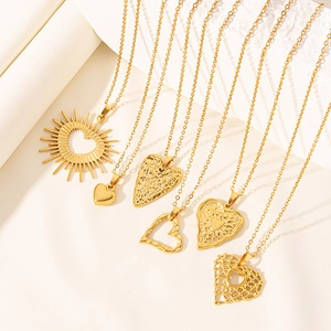 Set of six gold heart necklaces with diverse textures including sunray and hammered finishes
