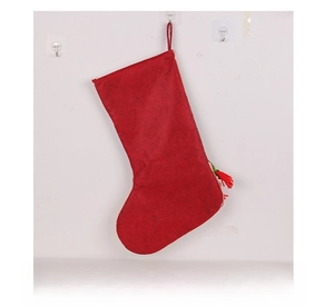 Detailed back view of a large red plush Christmas stocking with a convenient hanging loop