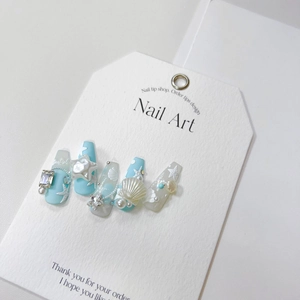 Ocean-themed long ballerina press-on nails with 3D starfish, shells, and pearls