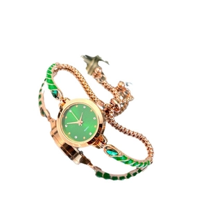 Elegant rose gold bracelet watch with a green round dial and emerald enamel accents