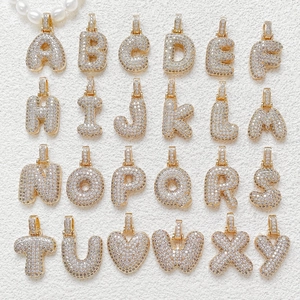Gold plated copper initial pendants and heart charms with sparkling cubic zirconia stones