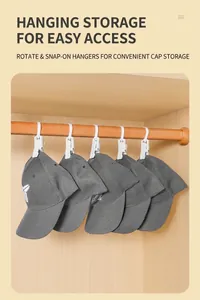 Close-up of white rotating plastic laundry clips hanging accessories in a closet
