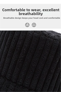 Macro shot of breathable black corduroy fabric texture with vertical ribbed knit pattern
