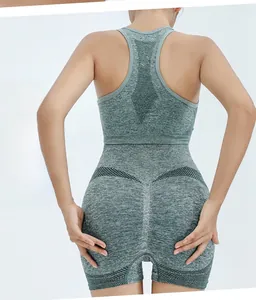 Detail of high-waisted seamless yoga shorts with breathable mesh and heathered green fabric