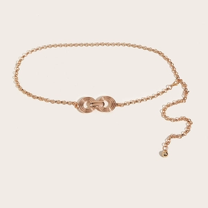 Close-up of rose gold metal waist chain with 8-shape buckle and adjustable extender
