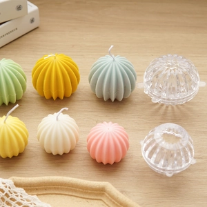 Macro detail of ribbed spherical candle molds and colorful textured DIY wax creations